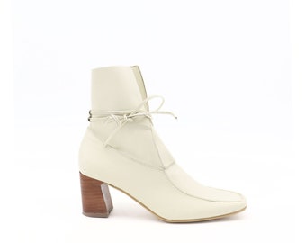 Awakening boots in ivory leather