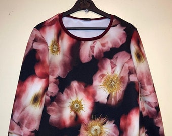 A floral print sweatshirt, with hand embellishment. Size Large