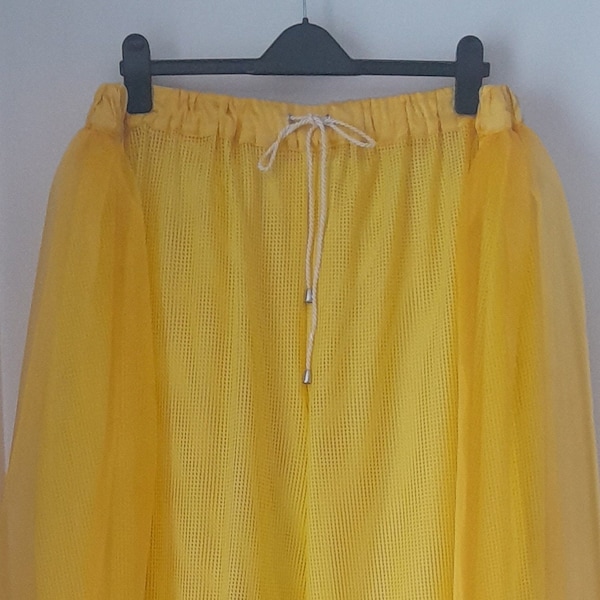 A pair of super wide leg yellow mesh trousers with sequin trim and a yellow organza extra long half skirt overlay, size 38-40 inch waist.