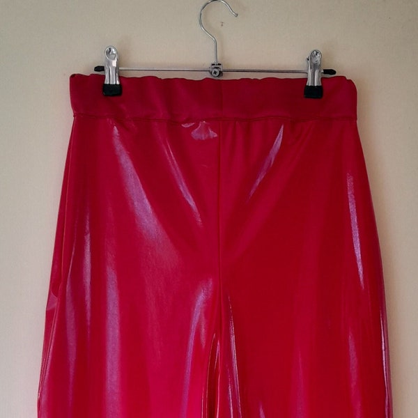 A pair of red wide leg PVC trousers, size 6