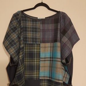 A tartan panel mix tabard cape with side fastenings, one size fits all.