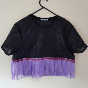 A black full sequin crop top with lilac fringe and sequin trim, size Small