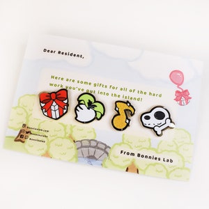 May include: A card with the text "Dear Resident, Here are some gifts for all of the hard work you've put into the island! From Bonnies Lab" and five enamel pins depicting a present, a turnip, a musical note, a bone, and a balloon.