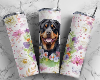May include: Three stainless steel tumblers with a floral design and a Rottweiler dog illustration. The tumblers are white with pink, purple, and green flowers. The dog is black and brown with a white chest.