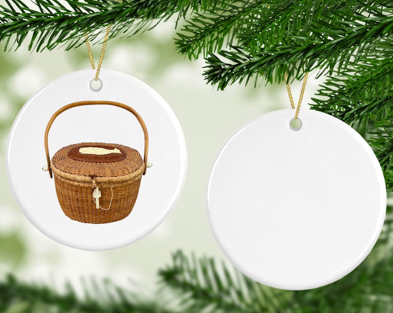 May include: Two white ceramic Christmas ornaments. One ornament features a brown wicker basket with a lid and a handle. The other ornament is blank.