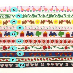 May include: Ten different types of white fabric ribbon trim with various colorful embroidered designs. The designs include flamingos, flowers, dogs, trains, strawberries, birds, and apples. Each ribbon is numbered 1 through 10.