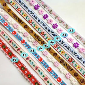 May include: Nine different types of ribbon trim with floral patterns. The ribbons are arranged in a row from top to bottom, with the numbers 1 through 9 written next to each ribbon.