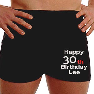 May include: Black boxer shorts with white text that reads "Happy 30th Birthday Lee". The number 30 is in red.