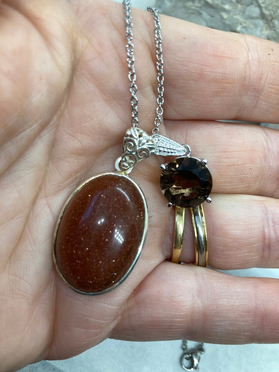 Two Pendants With One Silver Chain Pendants Are Goldstone and