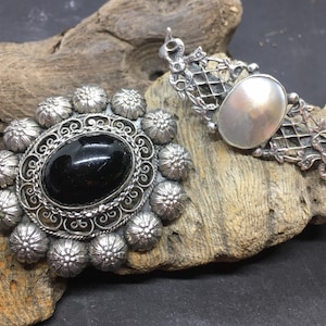 2 vintage or antique silver brooches