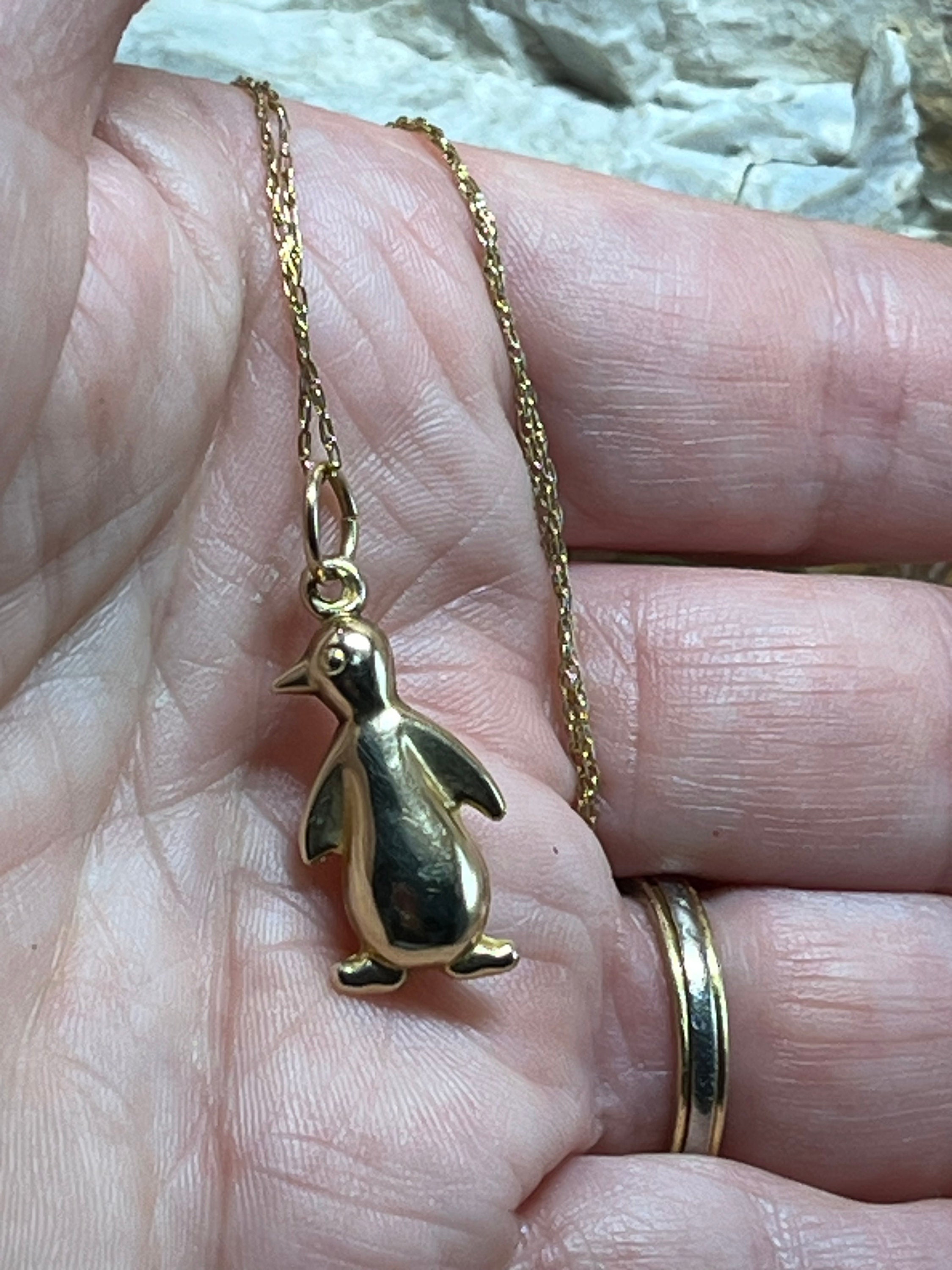 C. 1990 Vintage .60 ct. t.w. Diamond Penguin Pendant Necklace with Ruby  Accents in 18kt Yellow Gold. 16