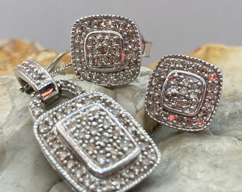 As new diamond earrings and diamond pendant set 9ct white gold