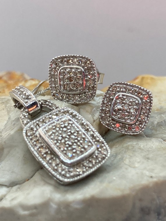 As new diamond earrings and diamond pendant set 9ct white gold