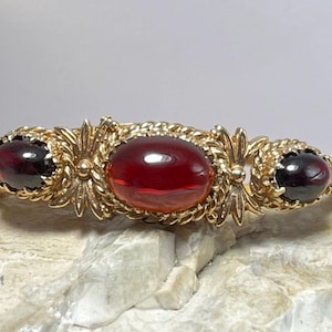 Fantastiskt armband i granat och guld, liten till medelstor handled, fullt stämplat