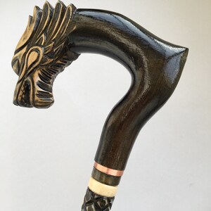 Dark brown wooden carved walking cane stick