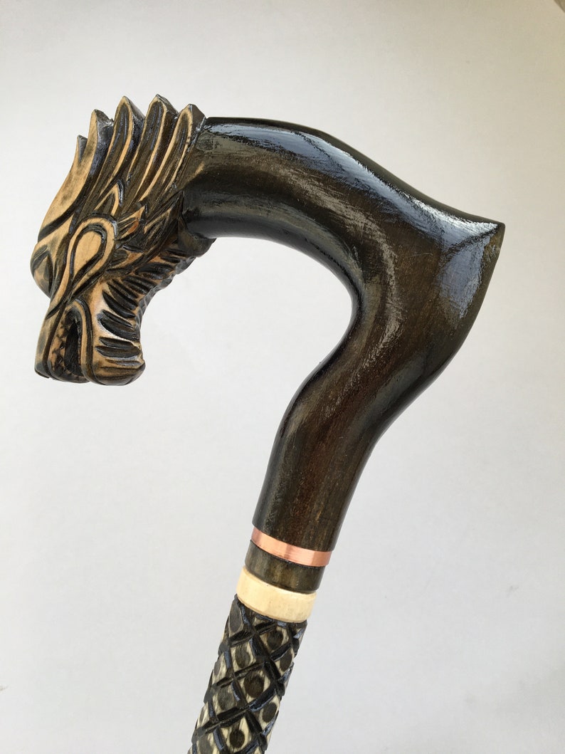 Dark brown wooden carved walking cane stick