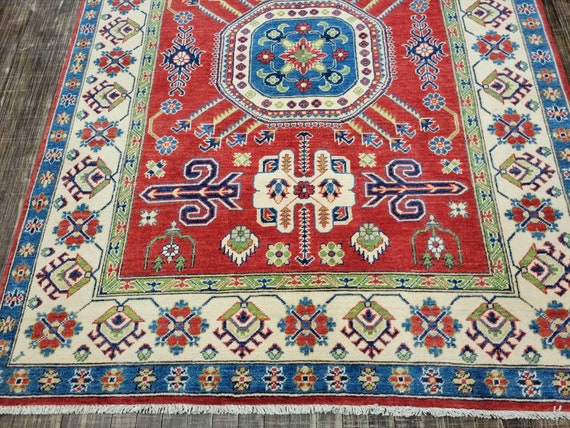 Afgan kazak Pakistani kazak  tribal rug hand knotted rug  transitional rug green and red  kazak size 5'3"×6'9"