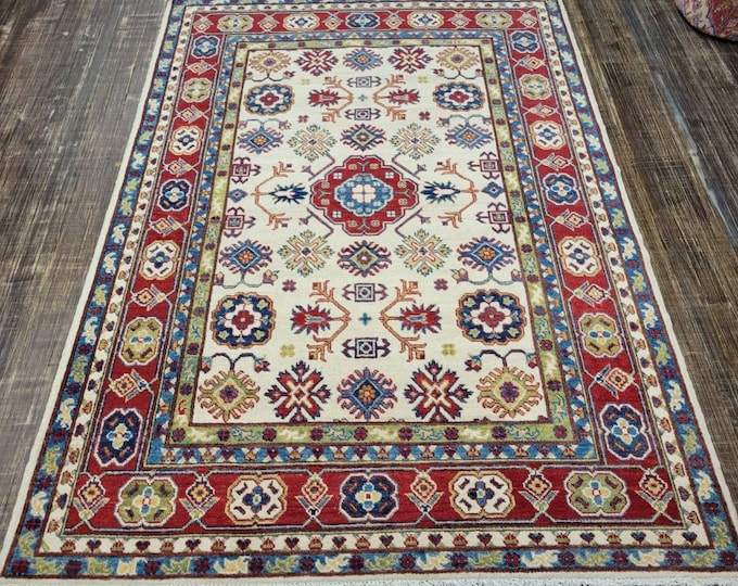 Afgan kazak Pakistani kazak  tribal rug hand knotted rug  transitional rug green and red  kazak size 5'2"×7'