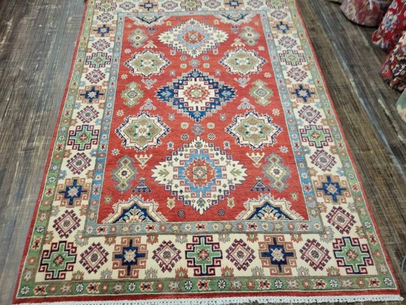 Afgan kazak Pakistani kazak  tribal rug hand knotted rug  transitional rug green and red  kazak size 5'8"×7'7"