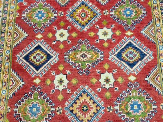 Afgan kazak Pakistani kazak  tribal rug hand knotted rug  transitional rug green and red  kazak size 5'×6'9"
