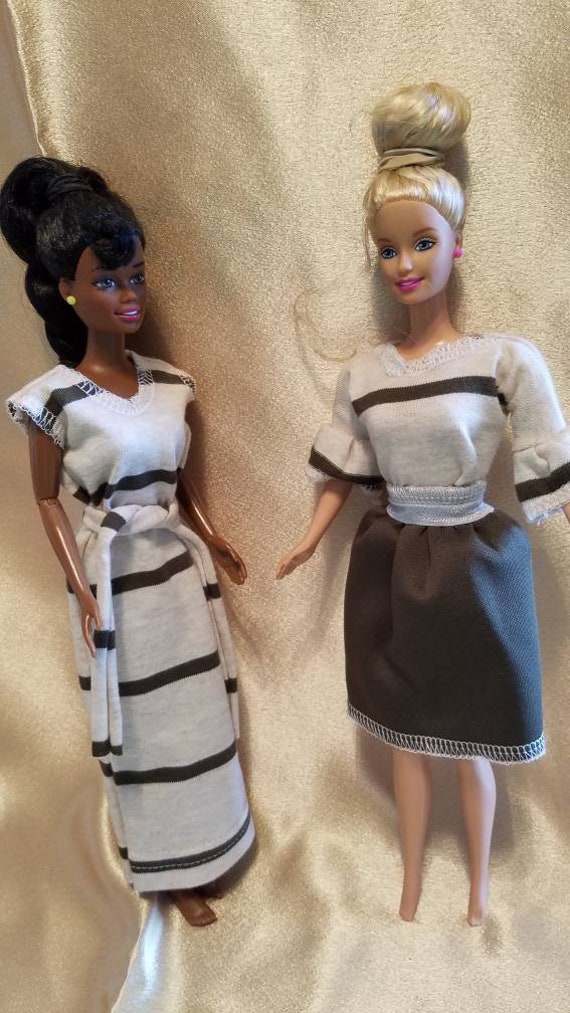 four barbie doll