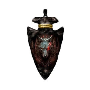 May include: A black arrowhead pendant with a wolf's head design. The wolf has a red eye and is surrounded by flames. The pendant is made of metal and has a gold trim.