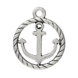 May include: Silver charm with a rope design circle and an anchor in the center.
