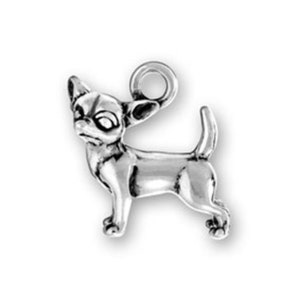 May include: Silver charm of a chihuahua dog, standing with its head turned to the side. The charm has a loop at the top for attaching to a bracelet or necklace.