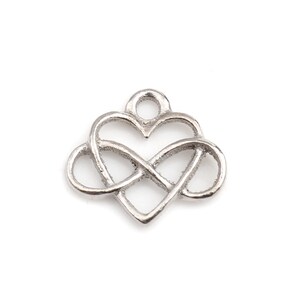 May include: Silver charm featuring an infinity symbol intertwined with a heart shape.