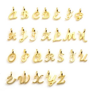 May include: Gold-toned alphabet letter charms, each letter is a separate charm. The letters are in a cursive font style.