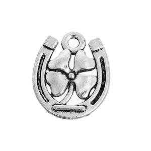 May include: Silver charm featuring a four-leaf clover inside a horseshoe. The charm has a loop at the top for attaching to a bracelet or necklace.