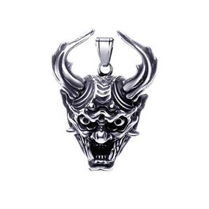 May include: A silver-toned metal pendant shaped like a horned demon mask with intricate facial features, including deep-set eyes, a wide open mouth with visible teeth, and a polished bail at the top for attachment to a necklace chain.