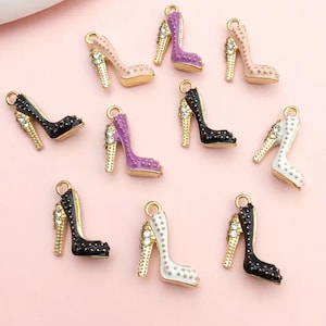 May include: Ten gold high heel shoe charms with different colored enamel finishes. The charms feature rhinestones and are perfect for adding a touch of glamour to jewelry projects.