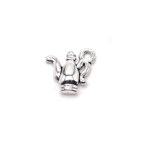 May include: Silver charm in the shape of a teapot with a loop for attaching to a necklace or bracelet.