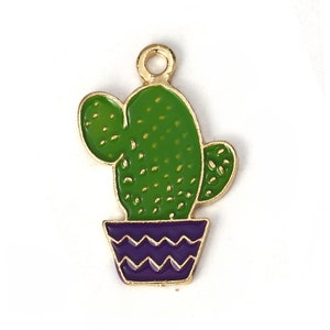 May include: Gold-tone metal charm featuring a green cactus with purple pot. The cactus has a textured surface and the pot has a wavy pattern.