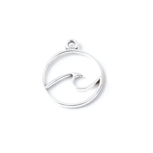 May include: Silver charm with a wave design inside a circle.