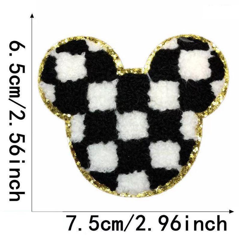 May include: Black and white checkered fabric iron-on patch in the shape of Mickey Mouse ears with a gold outline. The patch is 7.5 inches wide and 6.5 inches tall.