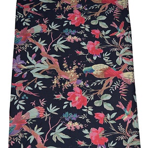 May include: Black fabric with a floral pattern featuring pink flowers, green leaves, and brown birds. The fabric has a vintage aesthetic.