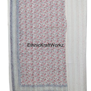 May include: White cotton kantha quilt with a floral print in shades of pink and green. The quilt has a border with a blue and white pattern. The text "EthnicKraftWorkz" is visible in the center of the quilt.