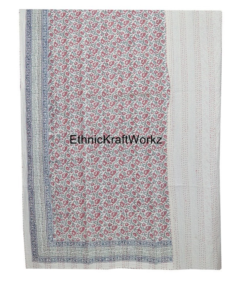 May include: White cotton kantha quilt with a floral print in shades of pink and green. The quilt has a border with a blue and white pattern. The text "EthnicKraftWorkz" is visible in the center of the quilt.