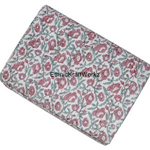 May include: A white cotton fabric with a pink and green floral print. The fabric has a subtle striped pattern and the text "EthnicKraftWorkz" is visible in the center.
