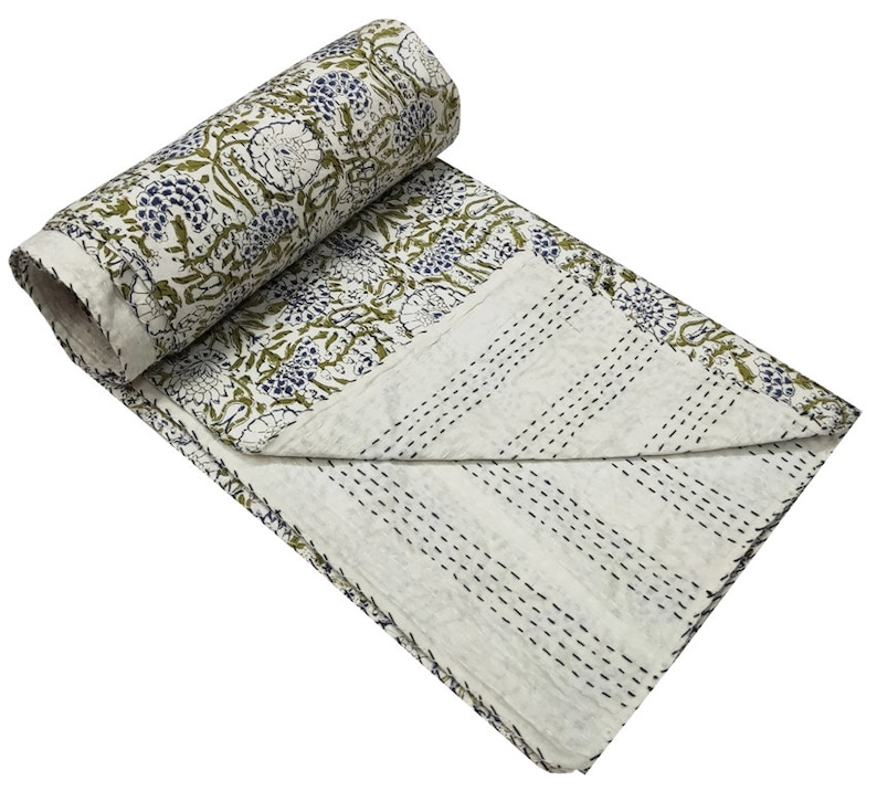 May include: White cotton kantha quilt with a floral pattern in shades of green and blue. The quilt is hand-stitched and has a traditional kantha design.