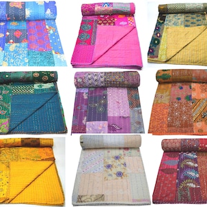 May include: Nine different kantha quilts in various colors and patterns. The quilts are made of recycled saris and are hand-stitched. They are perfect for adding a touch of bohemian style to any room.