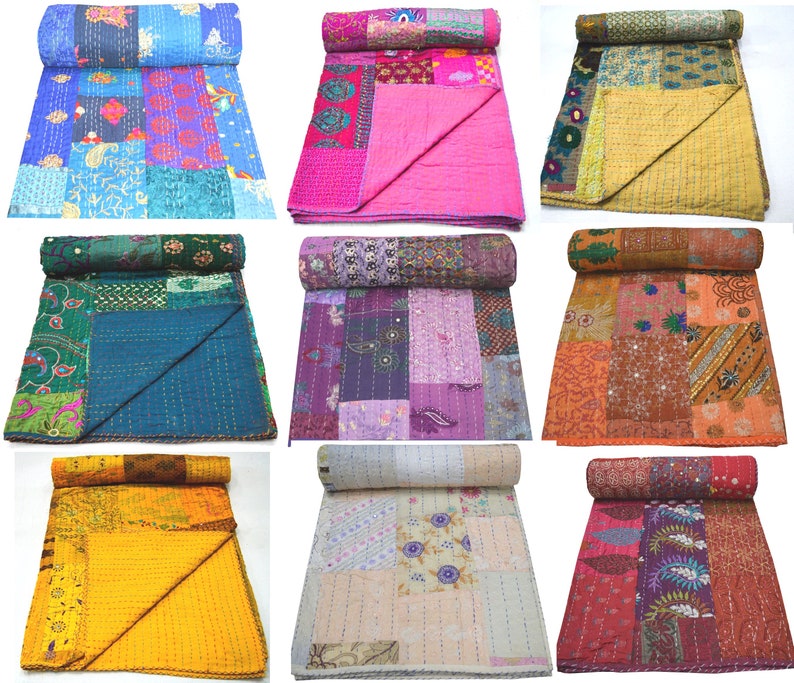May include: Nine different kantha quilts in various colors and patterns. The quilts are made of recycled saris and are hand-stitched. They are perfect for adding a touch of bohemian style to any room.