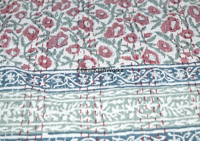 May include: A white cotton quilt with a floral pattern in shades of pink and green. The quilt has a blue and white border with a floral design. The text "EthnicKraftWorkz" is visible in the image.