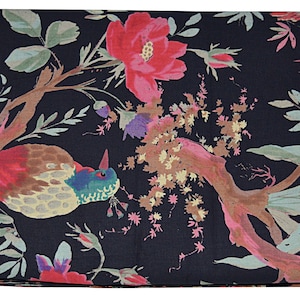 May include: Black fabric with a floral print featuring pink, red, and purple flowers, green leaves, and brown branches. Two birds with red, yellow, and blue feathers are perched on the branches.