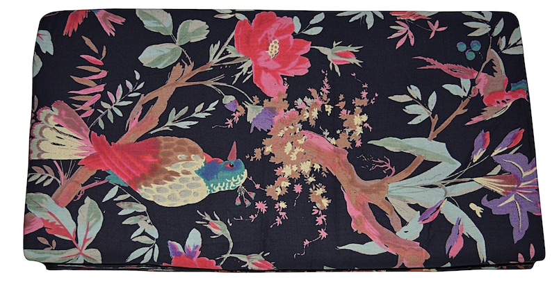 May include: Black fabric with a floral print featuring pink, red, and purple flowers, green leaves, and brown branches. Two birds with red, yellow, and blue feathers are perched on the branches.