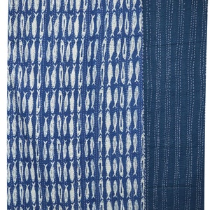 May include: A blue and white kantha quilt with a pattern of fish. The quilt is made of cotton and is hand-stitched.