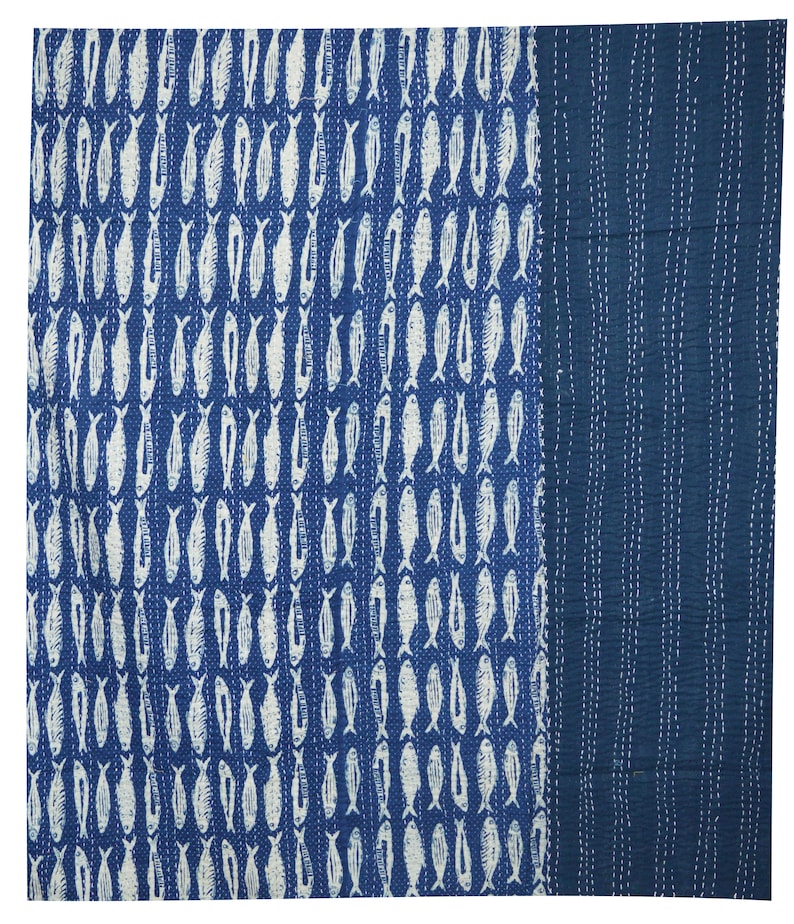 May include: A blue and white kantha quilt with a pattern of fish. The quilt is made of cotton and is hand-stitched.