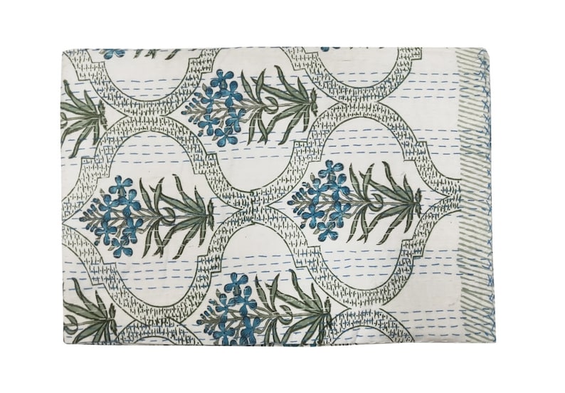 May include: White kantha quilt with a repeating pattern of blue and green floral designs. The quilt is hand-stitched and has a traditional Indian design.